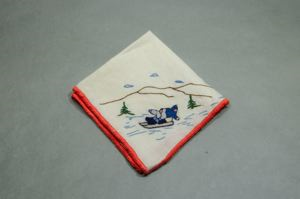 Image of Two figures on sledge, one of a set of 4 embroidered napkins, each with different outdoor activity 